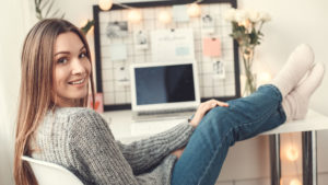Female college student relaxing at desk