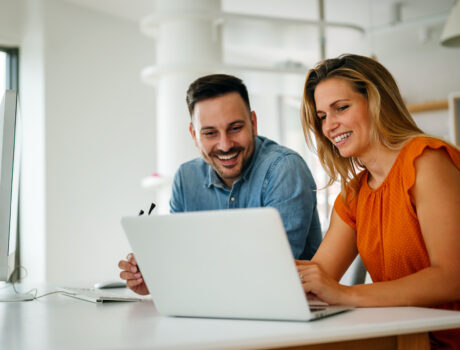 Portrait of success business people working together in home office. Couple teamwork startup concept