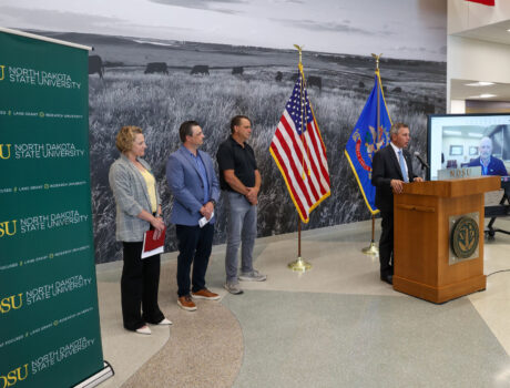 Gov. Armstrong announces the Grain Storage & Facility Rebuilder Program at NDSU. Armstrong was joined by (L-R) Miranda Meehan, NDSU Extension disaster coordinator, James Burgum, CEO at The Arthur Companies, and Steve Johnson, farmer from Page, ND.