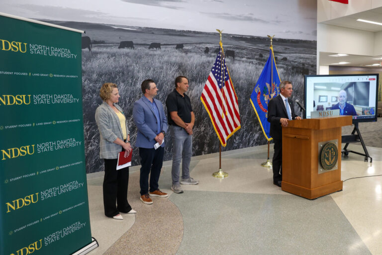 Gov. Armstrong announces the Grain Storage & Facility Rebuilder Program at NDSU. Armstrong was joined by (L-R) Miranda Meehan, NDSU Extension disaster coordinator, James Burgum, CEO at The Arthur Companies, and Steve Johnson, farmer from Page, ND.